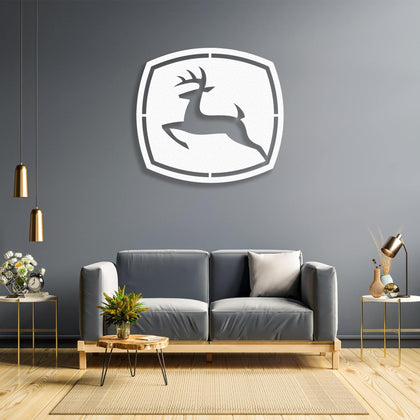 John Deere Metal Wall Art in white finish — laser-cut deer emblem mounted on a contemporary wall.