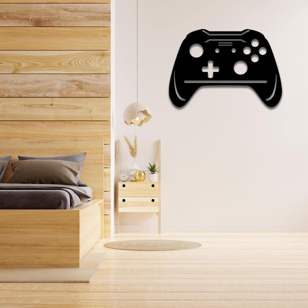  Black joystick metal wall art mounted on a white wall, enhancing a modern bedroom setup with wooden furniture, a cozy bed with neutral-toned pillows, and a small wooden shelf decorated with plants and ornaments.