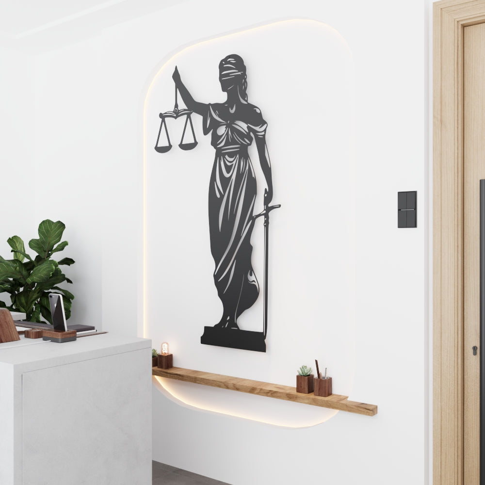 Decorative wall art of a woman holding scales and a sword in a modern interior setting.