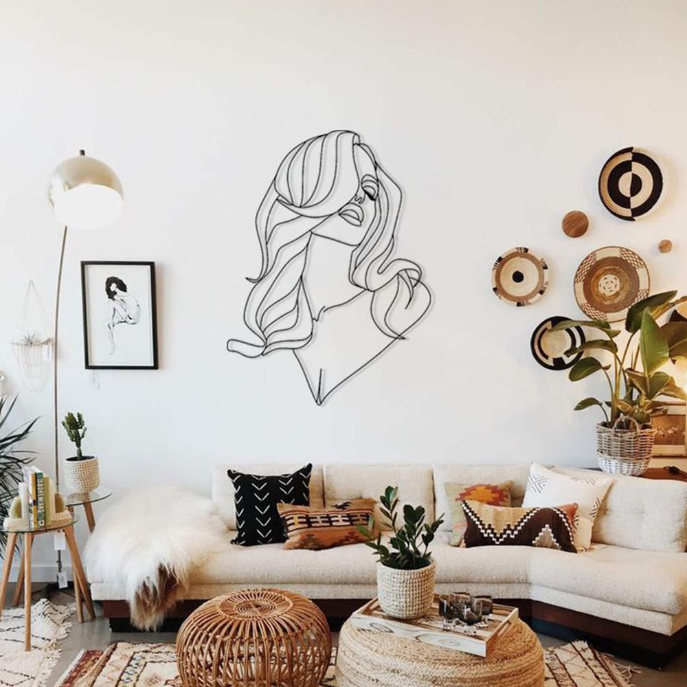 Long Hair Lady Silhouette Metal Wall Art in a living room