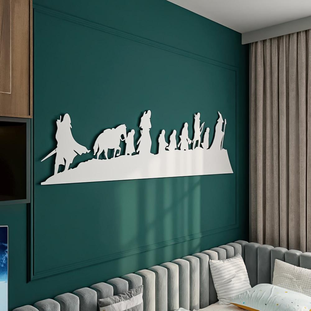 White "Lord of the Rings" metal wall art featuring the Fellowship of the Ring silhouettes, mounted on a green wall above a modern sectional sofa with cozy cushions, creating a cinematic ambiance.