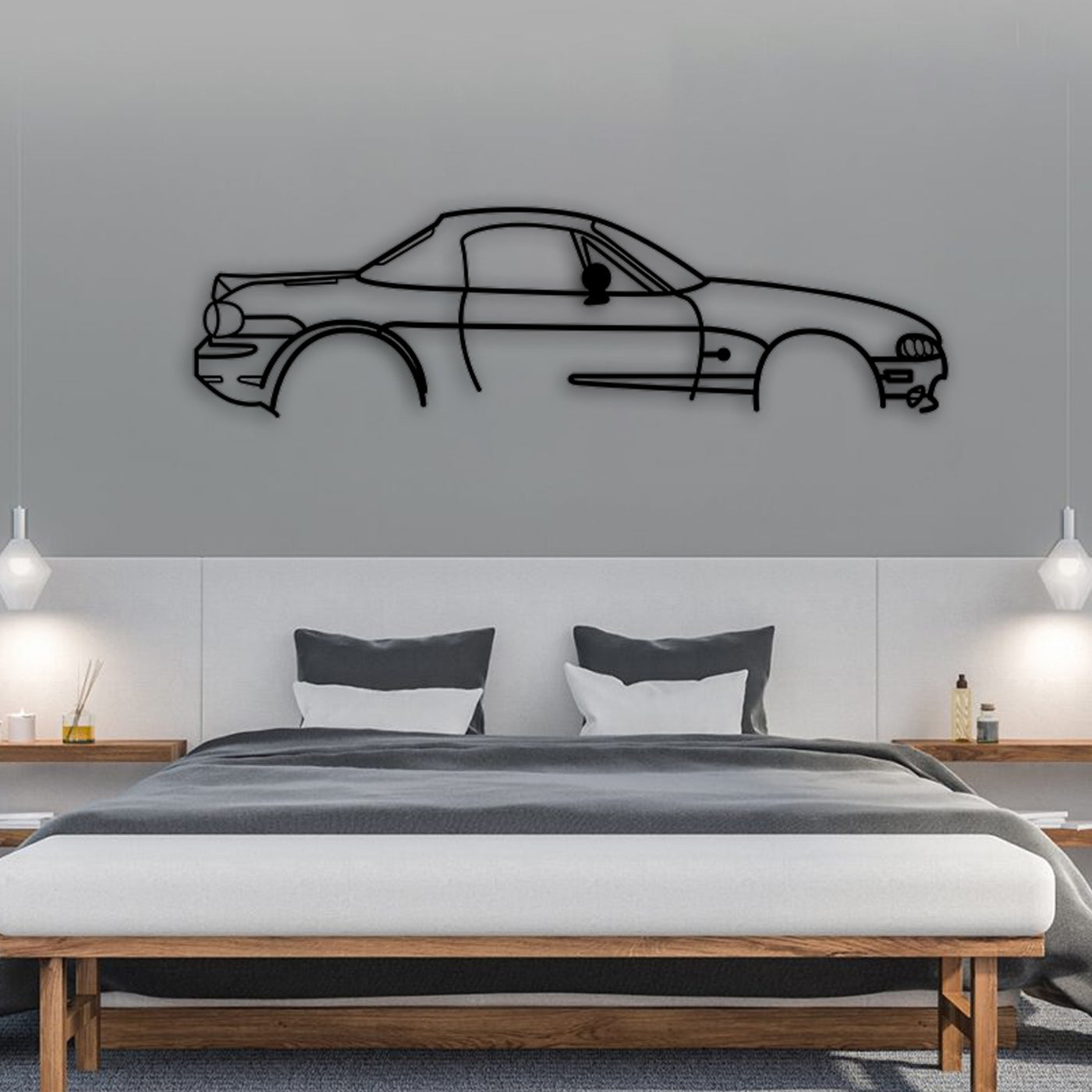 Mazda MX-5 Mk1 car silhouette metal wall art displayed above a bed.