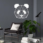 White geometric panda wall art displayed on a dark gray wall, styled with a modern chair, indoor plant, and books, creating a sleek and contemporary decor setting.