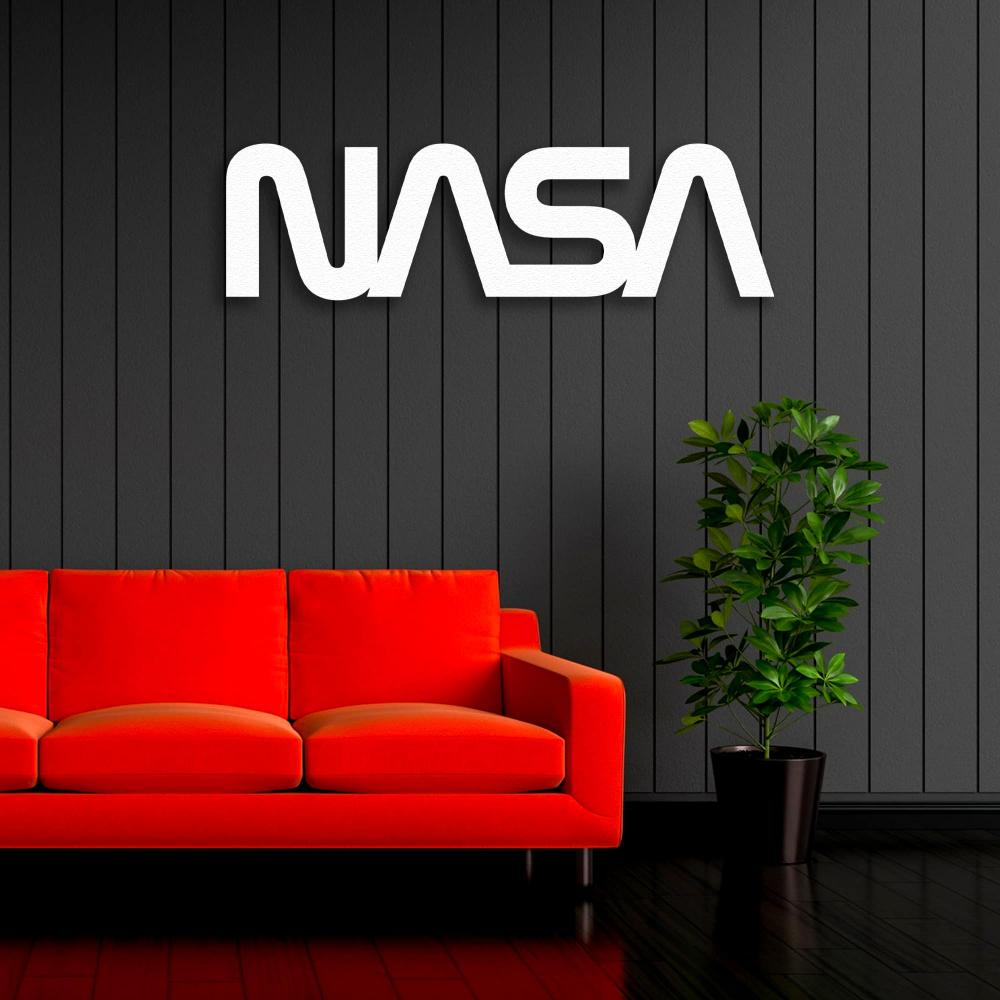 White NASA Sign Metal Wall Art in a living room