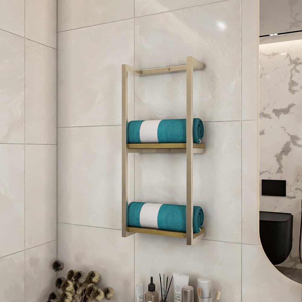 Wall-mounted bathroom shelf with a light wood base, holding neatly folded blue towels, mounted on a dark stone-tiled wall, creating a modern aesthetic