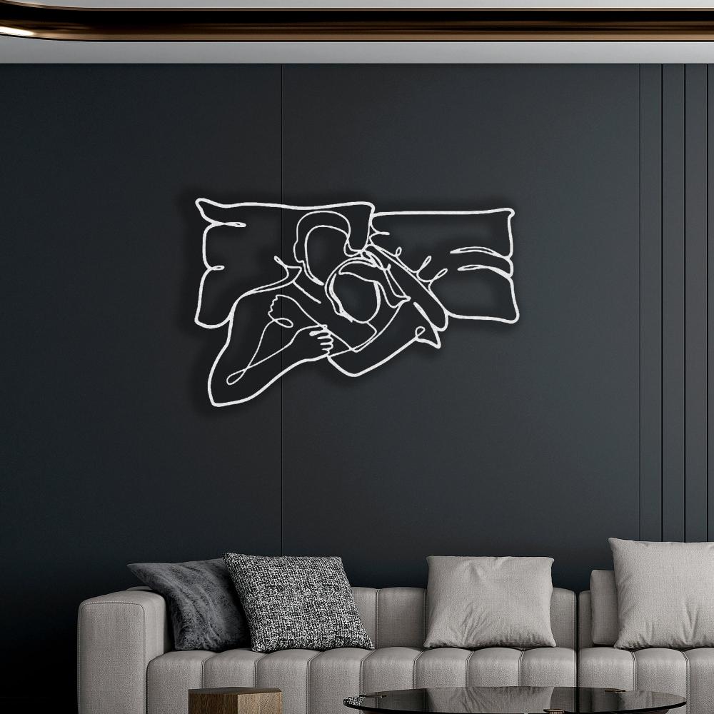 White Romantic Lying Couple Line Art Metal Wall Art in a living room