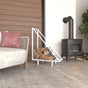White Modern Triangle Metal Wood Rack with a triangular design, styled indoors near a rustic stove and cozy seating area, holding neatly arranged firewood