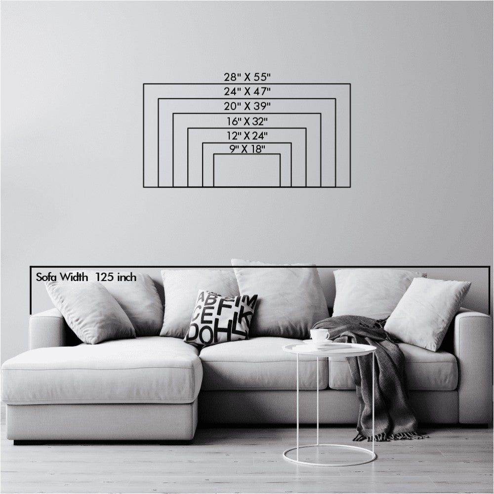 Size comparison chart for metal wall art displayed above a modern L-shaped sofa. The chart shows various dimensions ranging from 9" x 18" to 28" x 55", helping customers visualize the appropriate size for their wall art. The sofa width is labeled at 125 inches, with neutral cushions and a minimalist design, offering a clear reference for scale and fit.