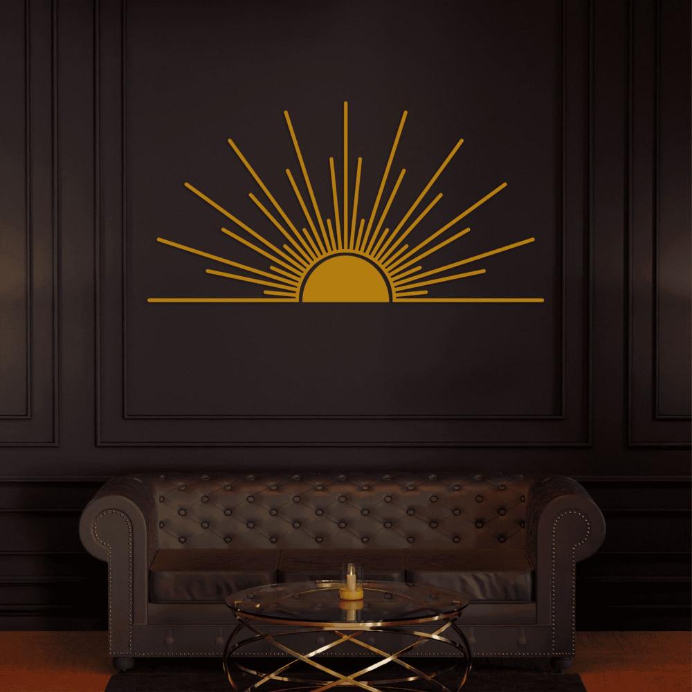 Gold minimalist sunburst metal wall art with a sunrise design mounted on a dark wall, complementing a luxurious black leather tufted sofa and a sleek glass coffee table.