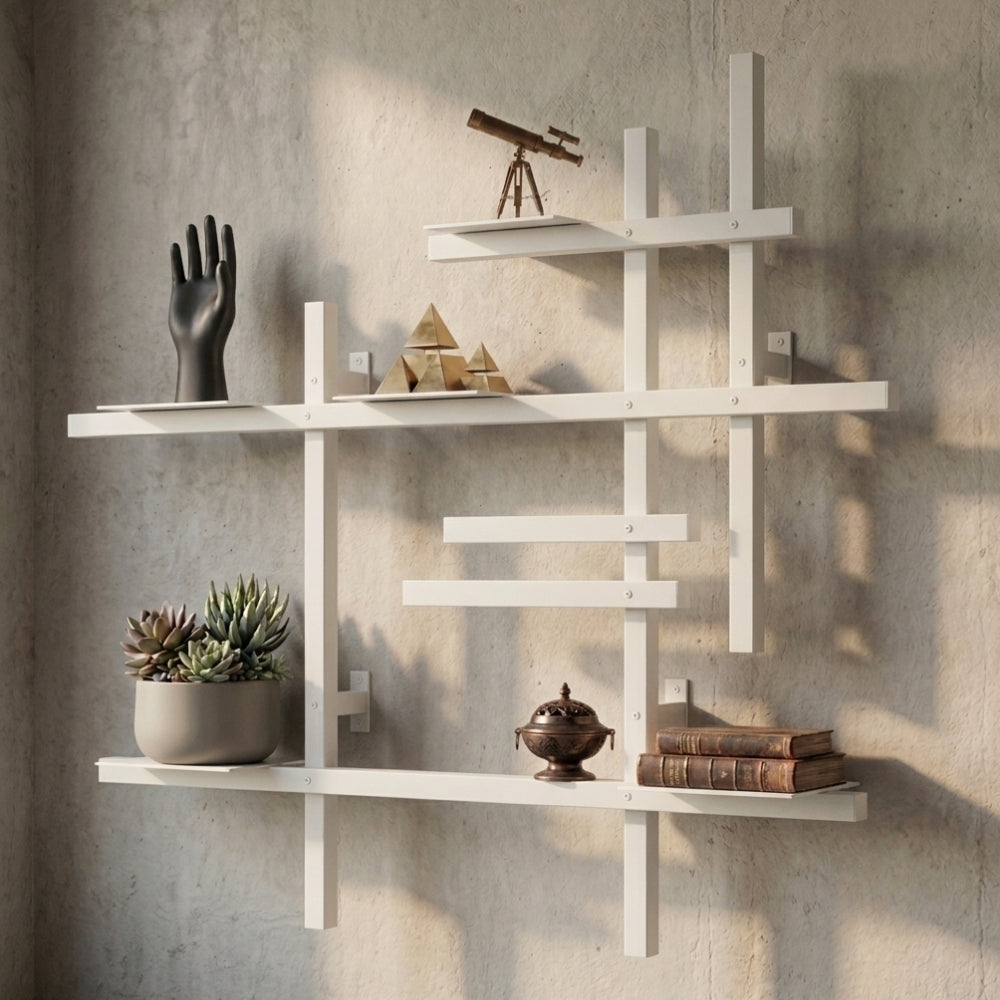 White modular metal wall shelf with books, plants, and decorative objects on a textured wall.