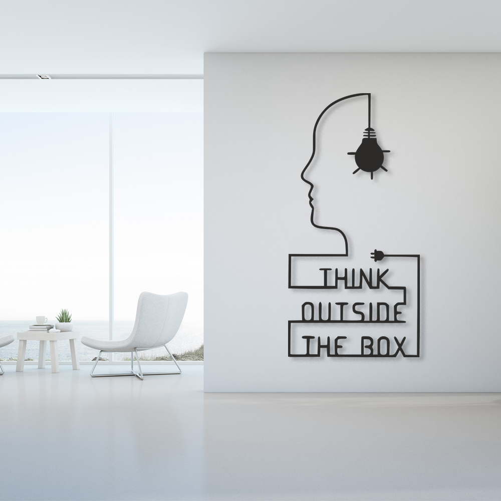 Decorative wall art with 'Think Outside The Box' quote in a modern interior setting.