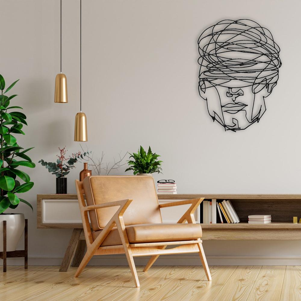 Overthinking Man Geometric Face Metal Wall Art in a living room