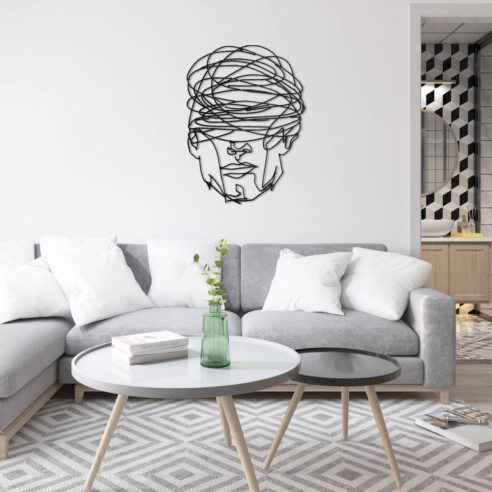Black Overthinking Man Geometric Face Metal Wall Art in a living room