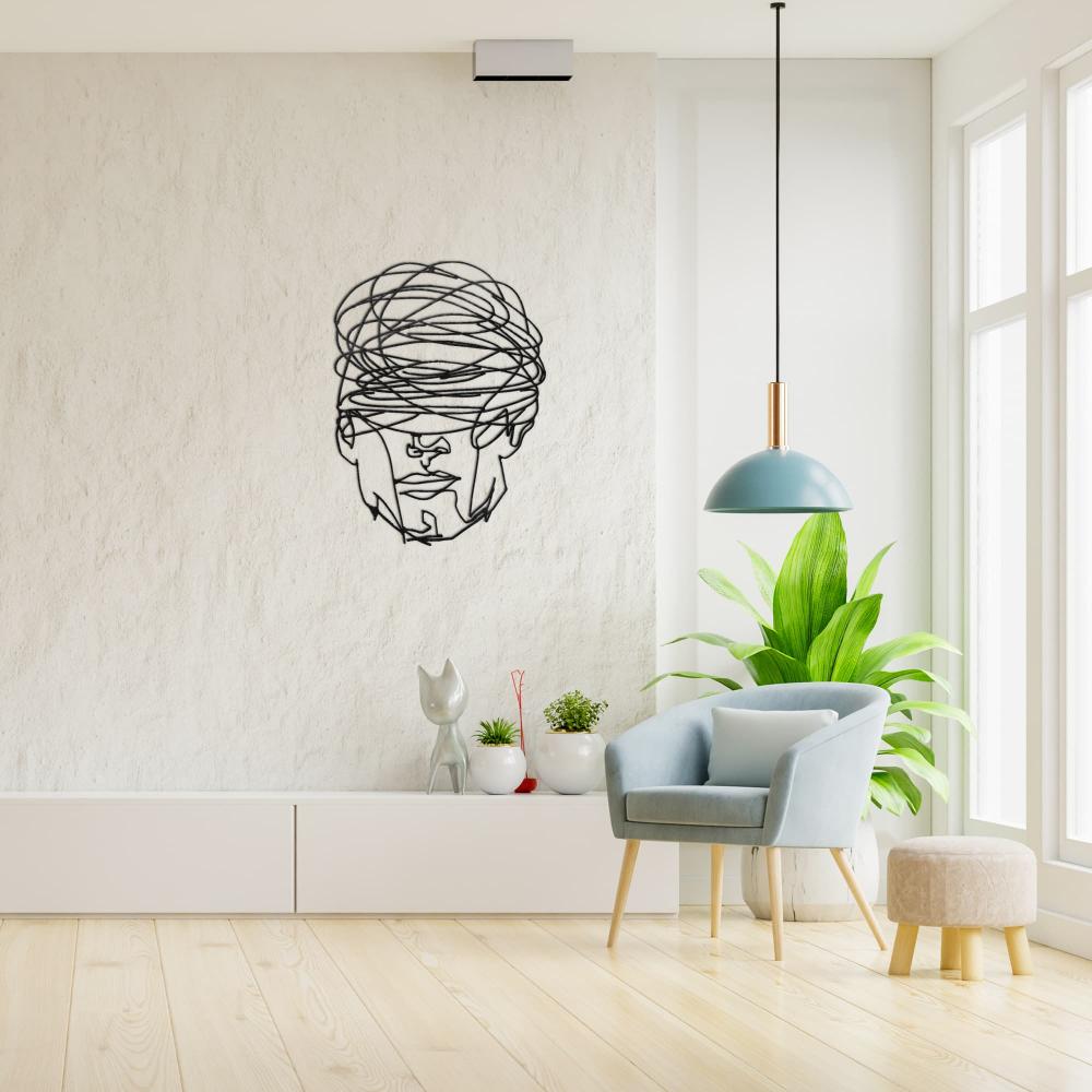 Black Overthinking Man Geometric Face Metal Wall Art in a living room