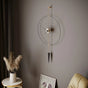 Gold 60 cm pendulum wall clock with minimalist round frame.