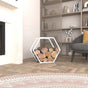 White portable hexagonal firewood rack placed in a modern living room, filled with firewood logs, complementing the neutral-toned decor