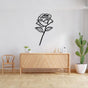  Black metal wall art featuring an open window with bird silhouettes perched on wires and a flying parrot in the center, mounted on a lime green wall above a white couch with green floral-patterned cushions and a black wall clock.