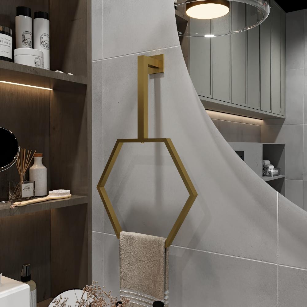 Modern bathroom featuring a minimalist design with a gold wall-mounted hexagonal towel ring. The hexagonal frame adds an elegant touch to the decor, blending seamlessly with the neutral tones and sleek shelving unit.