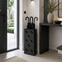 Modern white metal umbrella stand with repeating umbrella pattern in contemporary entryway