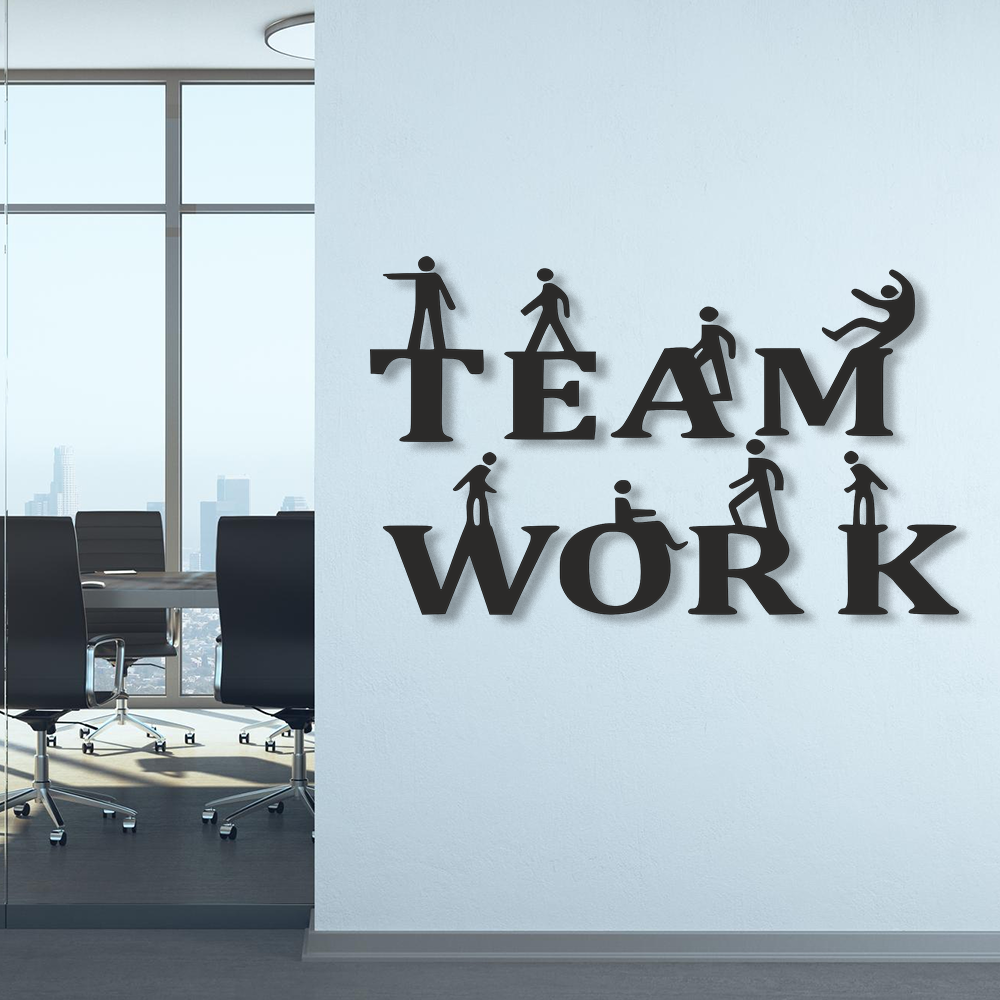 Laser-cut galvanized metal wall art with 'TEAM WORK' text and silhouettes of people in a modern office setting.