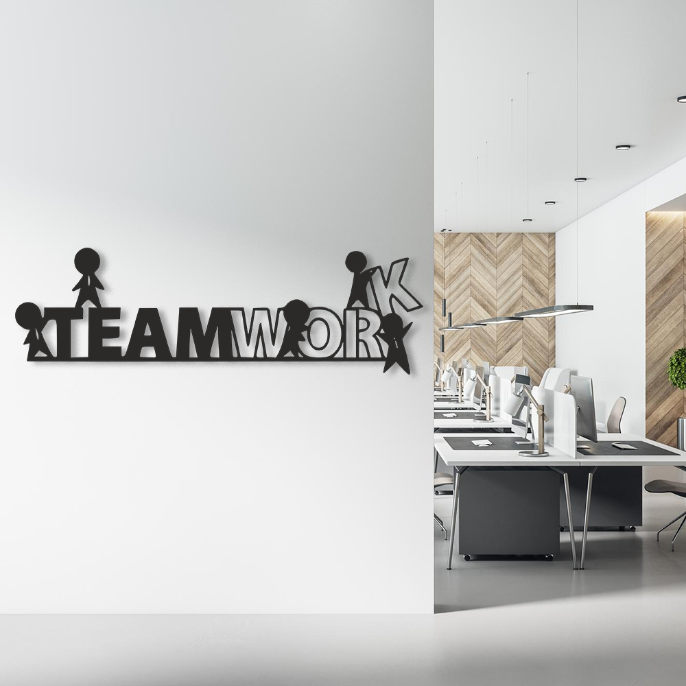 Modern office interior with a 'TEAMWORK' wall decoration.