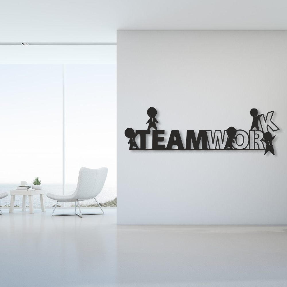 Decorative wall art with 'TEAMWORK' on a white wall in a modern room.