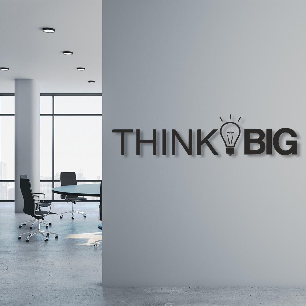 Modern office interior with 'THINK BIG' motivational quote on a wall