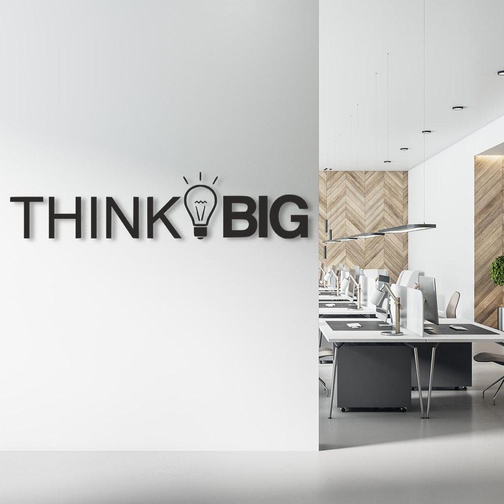 Modern office interior with 'THINK BIG' motivational quote on wall