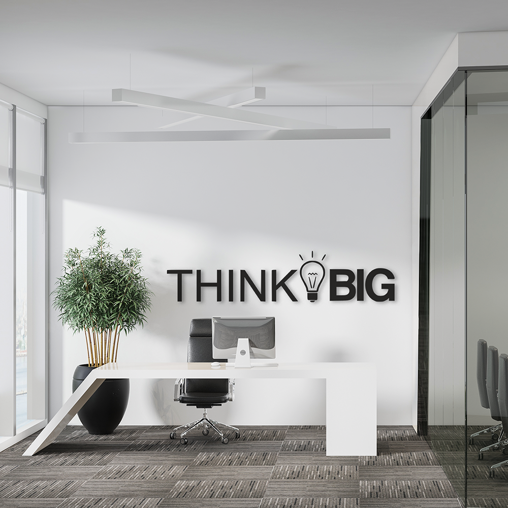 Modern office interior with a 'Think Big' wall decoration.