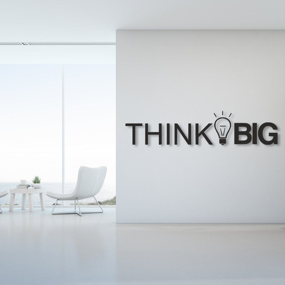 Modern office interior with 'THINK BIG' wall art