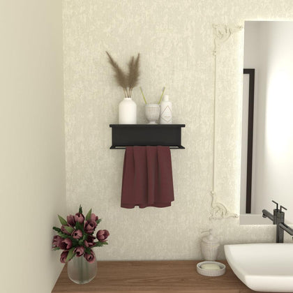  A black wall-mounted towel holder with a shelf, styled with decorative items and a red towel, adding functionality and elegance to a bathroom. 