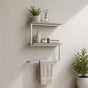 Satin nickel wall mounted 2-tier towel shelf with towel bar holding towels and bathroom decor.