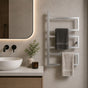 Satin nickel wall mounted 3-tier towel rack holding gray and cream towels in a modern bathroom.