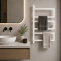White wall mounted 3-tier towel rack holding gray and cream towels beside a modern bathroom vanity.