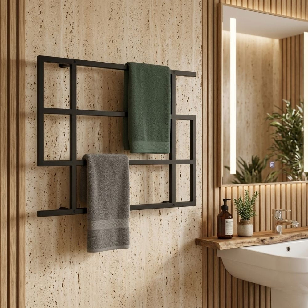 Black wall mounted geometric towel rack holding towels in a warm wood bathroom interior.