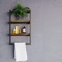 A black wall-mounted shelf with wooden tiers, styled with a plant and glass bottles.