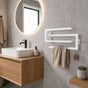White wall mounted swivel towel rack installed above a bathroom vanity.