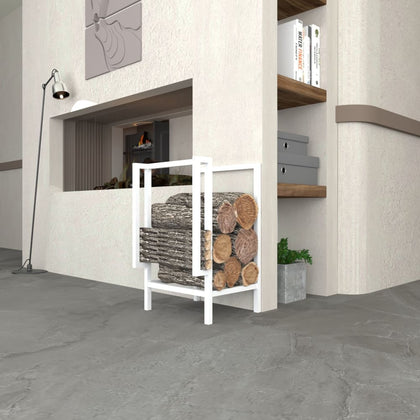 Modern white metal firewood and kindling storage placed next to a fireplace and bookshelves, filled with neatly stacked logs.