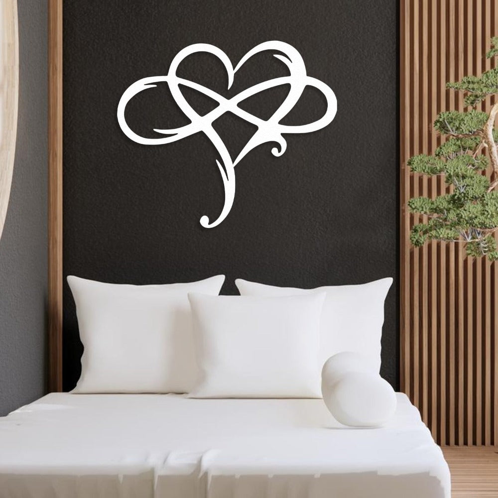 White Infinity Heart Metal Wall Art in a bedroom