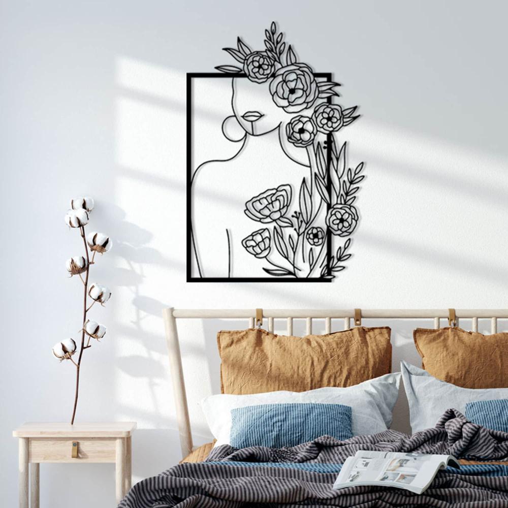 Woman Silhouette and Roses Metal Wall Art in a bedroom