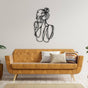 Black Minimalist Woman Figure Metal Wall Art in a living room