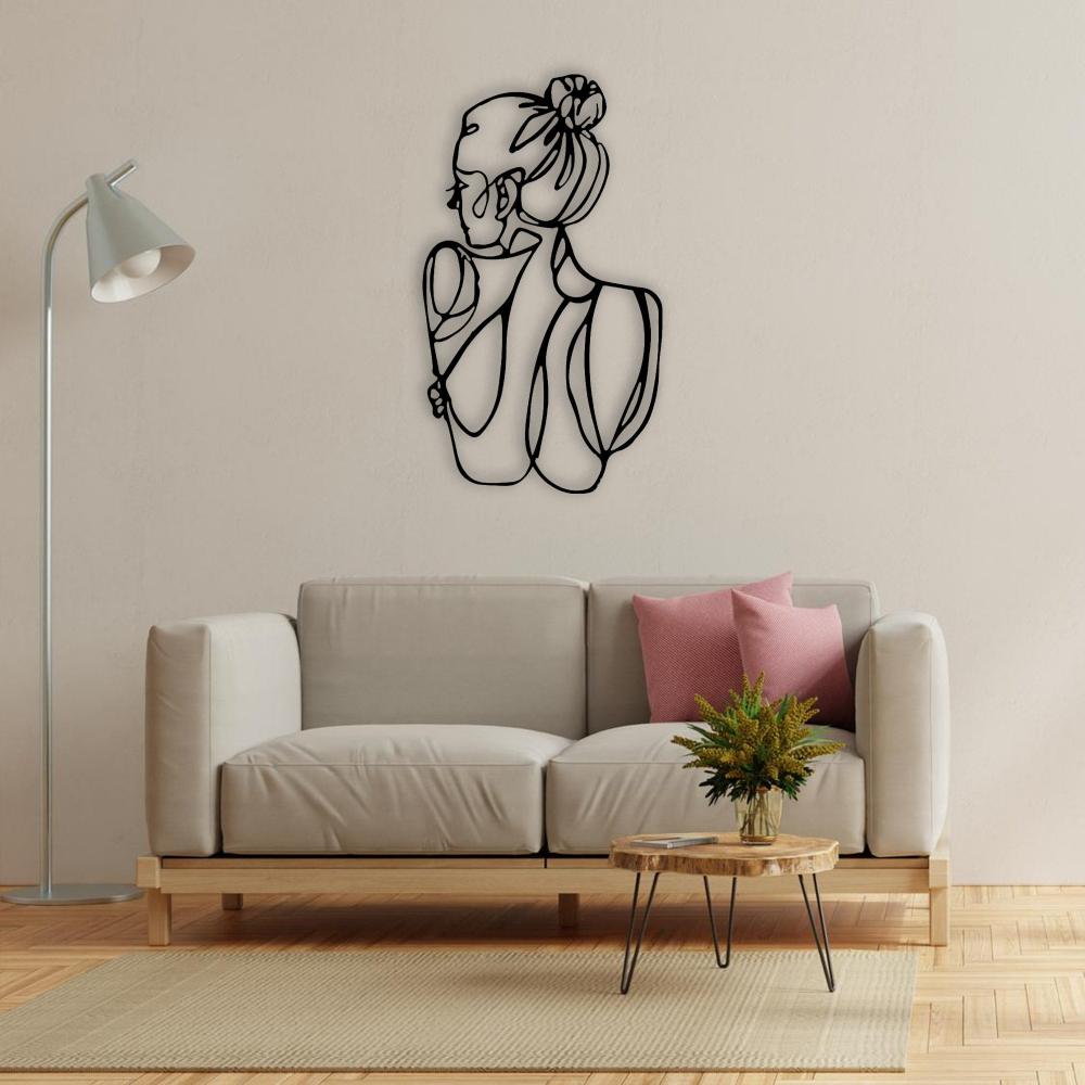 Black Minimalist Woman Figure Metal Wall Art in a living room
