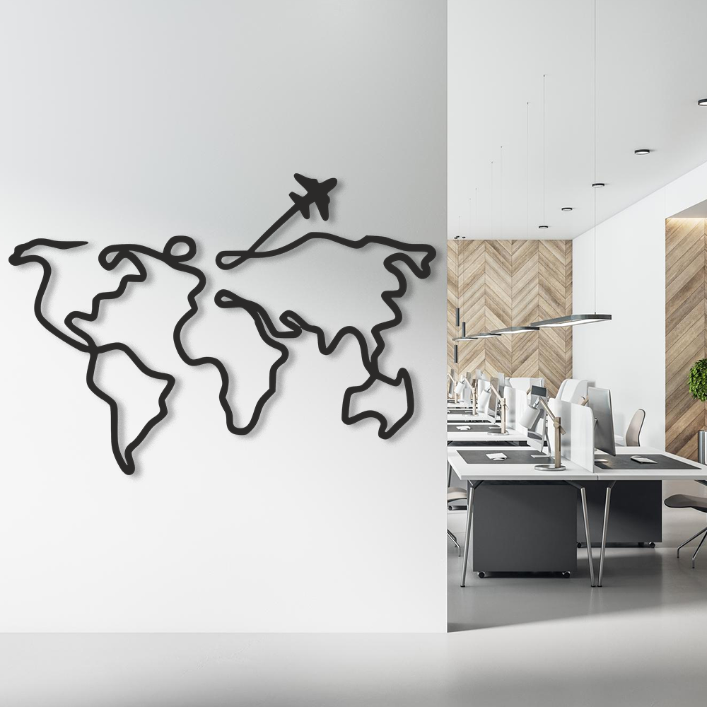World map wall decoration with an airplane on a white wall, next to a modern office interior.